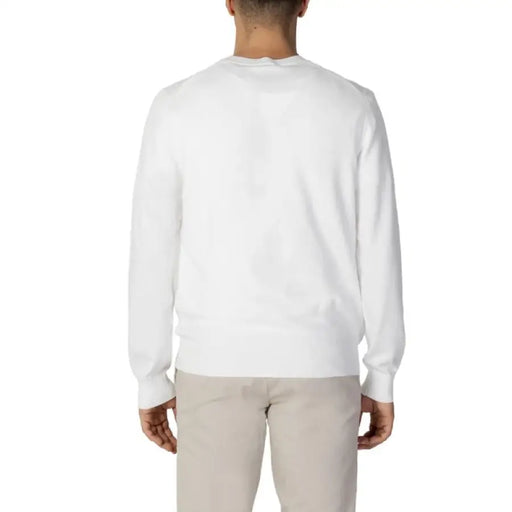 White crewneck sweater back view from the Diktat Men’s Long Knit Sweater collection