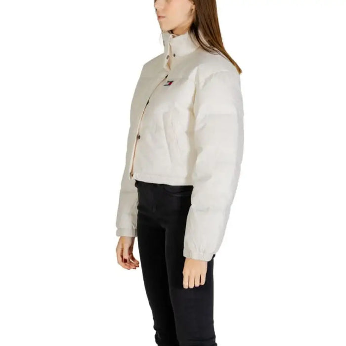 White cropped puffer jacket with high collar and button closures by Tommy Hilfiger