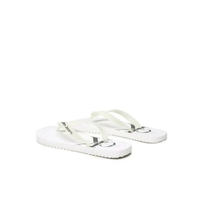 White flip-flop sandals featuring Calvin Klein logo from Calvin Klein Jeans Men Slippers