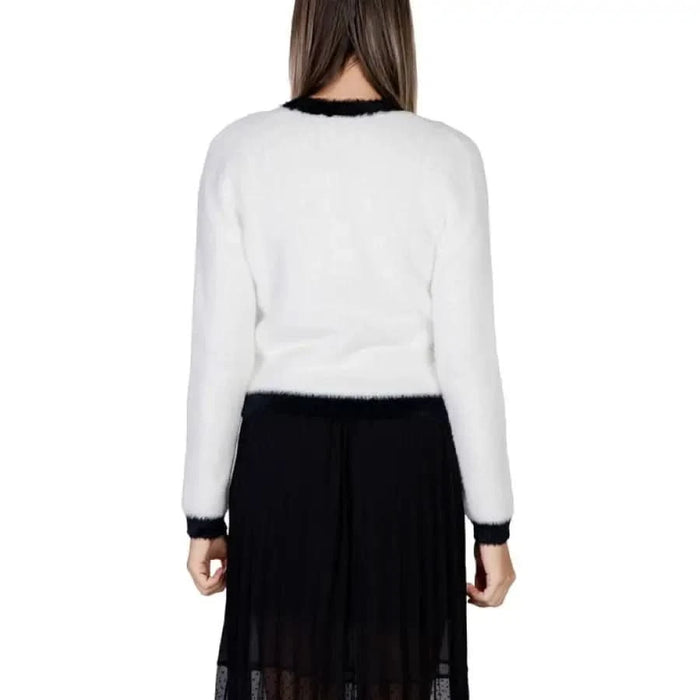 White fuzzy sweater with black trim at neckline and cuffs from Morgan De Toi Women Knitwear