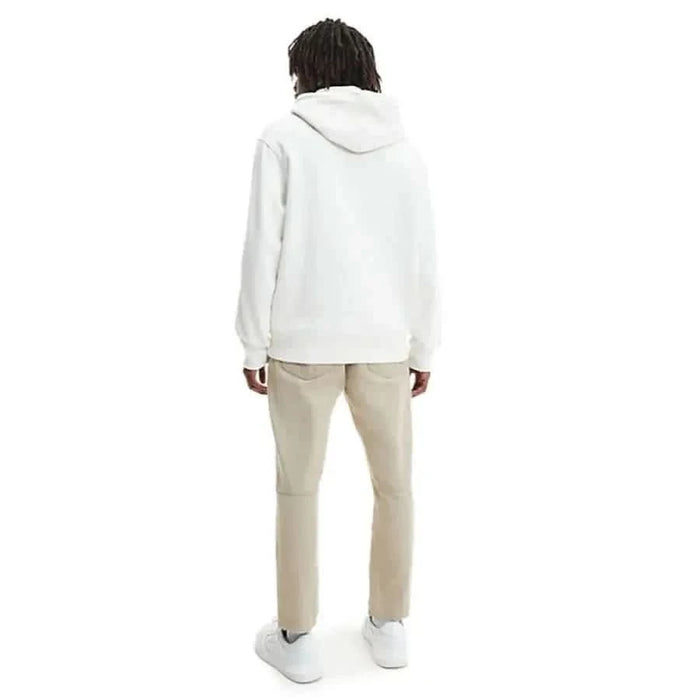 White hooded sweatshirt modeled by a person with dark hair from Calvin Klein Jeans