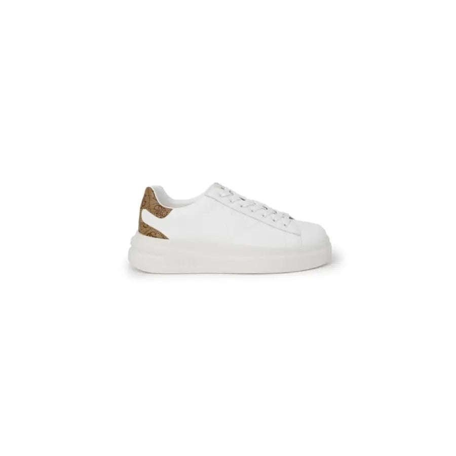 White leather Guess women’s sneaker with thick sole and gold accents on the heel
