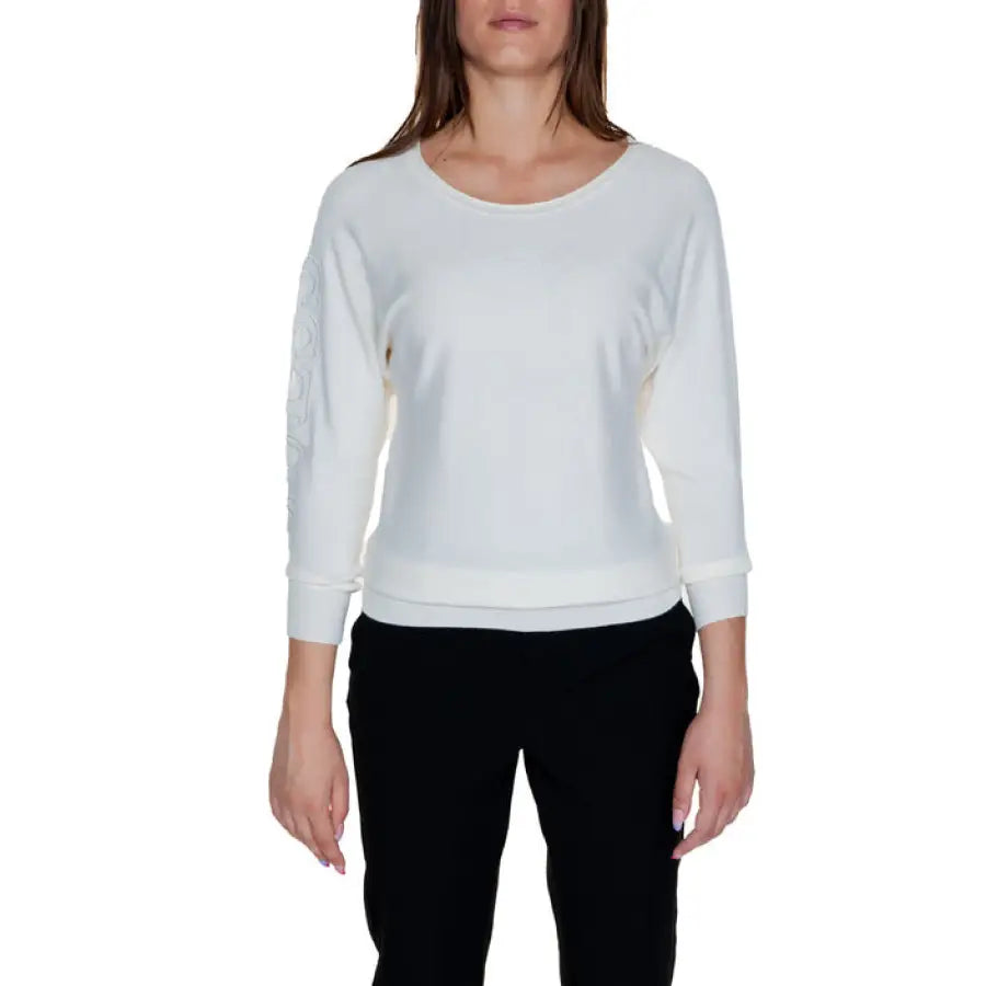White long-sleeved scoop neck top with black pants, Guess Women Knitwear