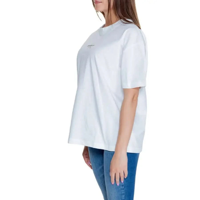 Calvin Klein Jeans Women T-Shirt: White oversized tee with blue jeans