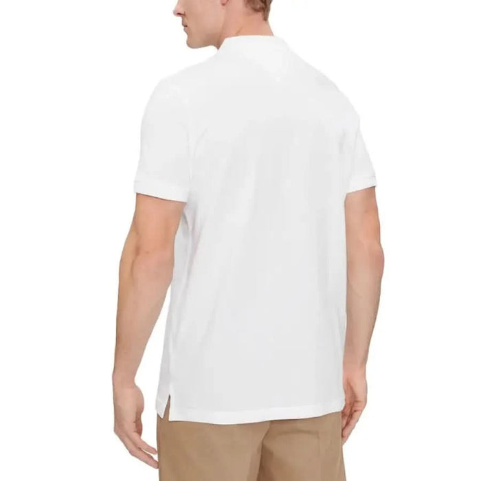 White polo shirt viewed from the back, featuring Tommy Hilfiger Jeans design for men