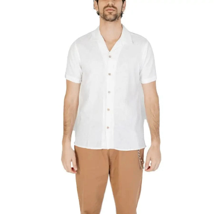 Hamaki-ho Men Shirt - White short-sleeved button-up with tan pants worn by a man