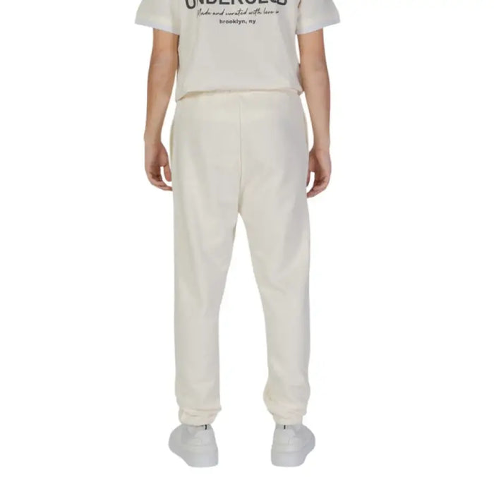 White Underclub Men Trousers featuring elastic cuffs at the ankles