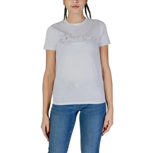 White Guess Women T-Shirt featuring a graphic text design on the front