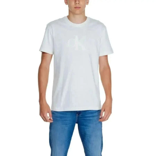 White Calvin Klein Men T-Shirt paired with blue jeans for a stylish casual look