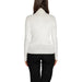 White turtleneck sweater worn by a model with long dark hair from Guess Women Knitwear