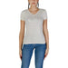 White v-neck t-shirt featuring a metallic logo graphic from Guess Women T-Shirt collection