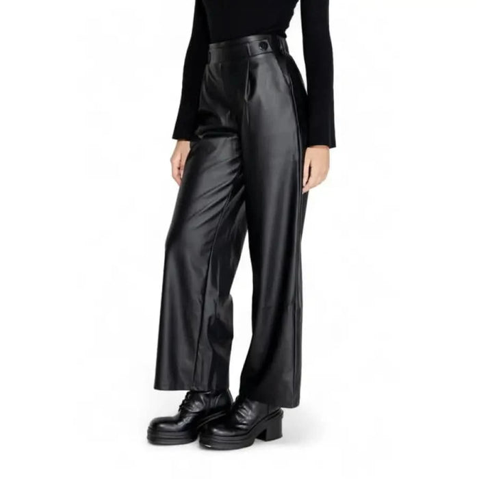 Wide-leg black leather pants with chunky platform shoes for Jacqueline De Yong trousers