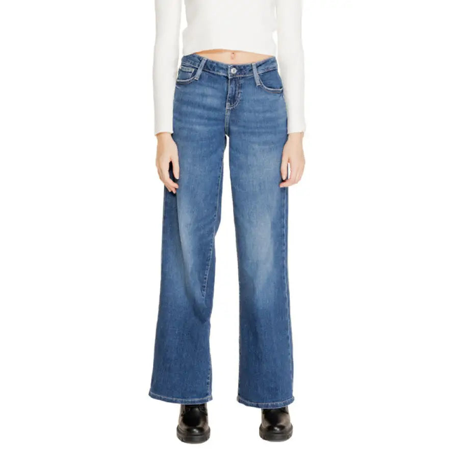 Wide-leg blue jeans with a white crop top from Guess Women’s Jeans collection
