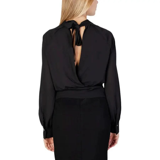 Sandro Ferrone woman in black bow neck blouse