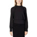 Woman in Sandro Ferrone black top and skirt, Sandro Ferrone Women Blouse feature