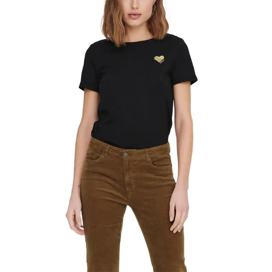 Woman in a black t-shirt with gold heart emblem and brown pants from Only - Only Women T-Shirt