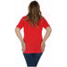 Woman in bright red Love Moschino T-shirt and blue jeans, back view