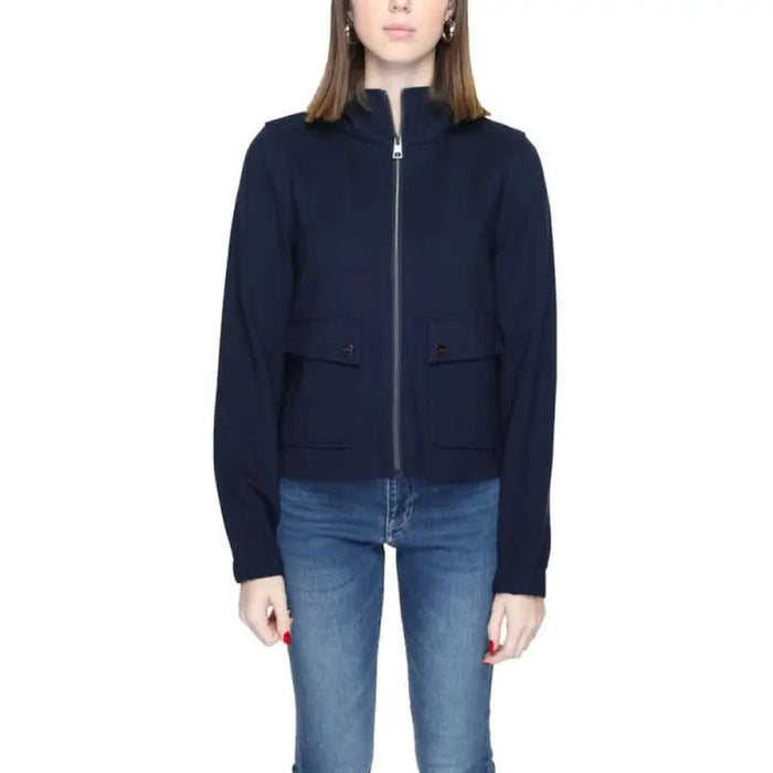 Urban style: Woman in Street One navy jacket with zipper, fashionable clothing