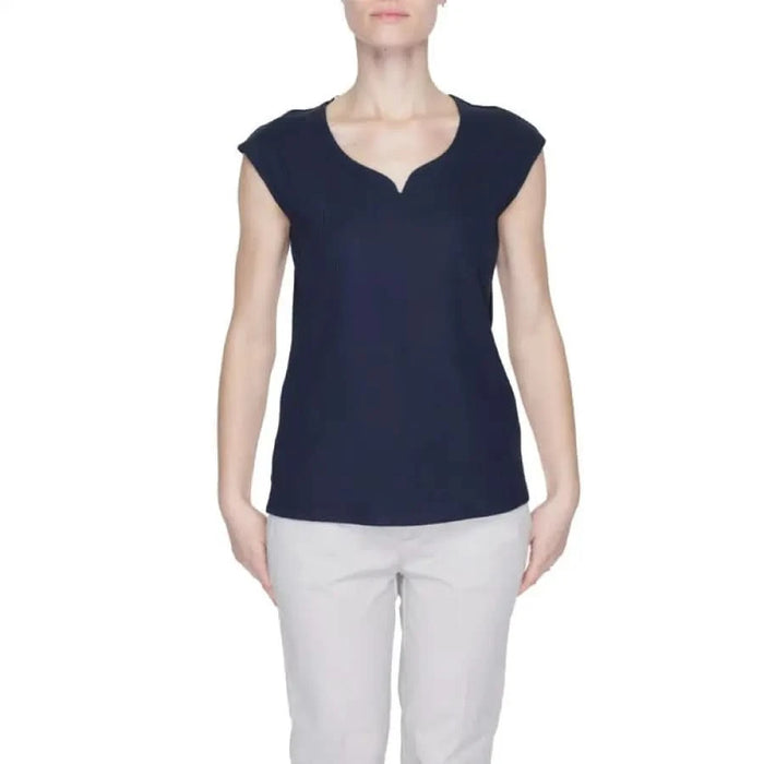 Woman in navy v-neck top showcasing urban style clothing from Street One collection