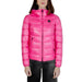 Woman modeling Blauer women jacket in pink with black pants