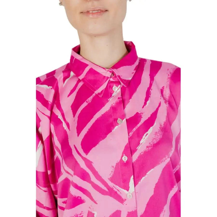 Woman in pink Only shirt showcasing urban city style fashion