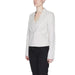 Woman in white Vero Moda jacket, black pants - urban chic style