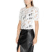 Woman in white lace top and black leather skirt wearing Morgan De Toi T-Shirt