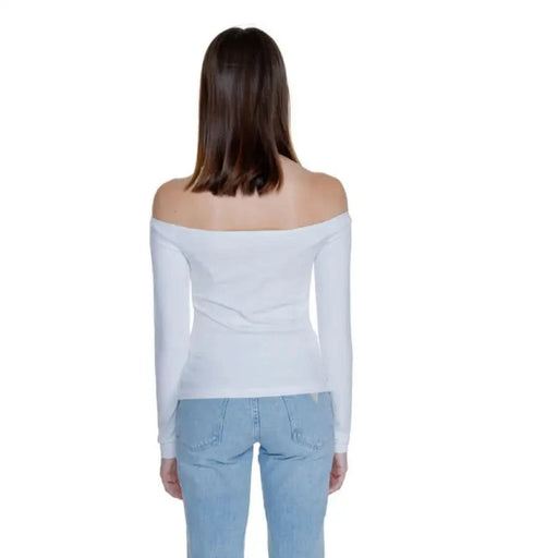 Back view of woman in white off-shoulder top and blue jeans - Tommy Hilfiger Women T-Shirt