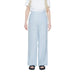 Vero Moda woman in urban style clothing, white shirt and blue pants