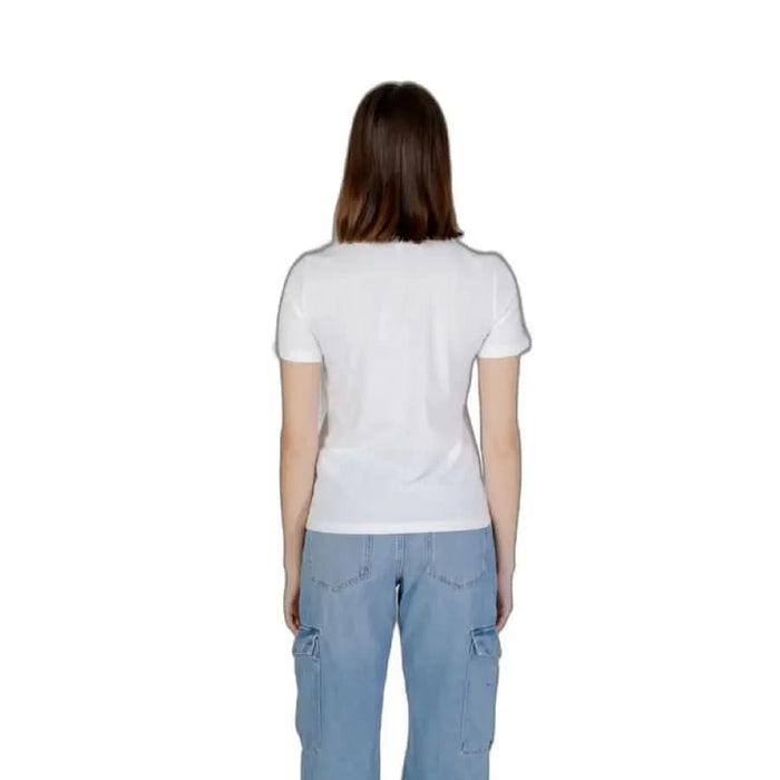 Rear view of woman in white t-shirt and light blue cargo pants from Only Women T-Shirt collection