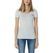 Woman in white V neck t-shirt, perfect spring summer product by Guess