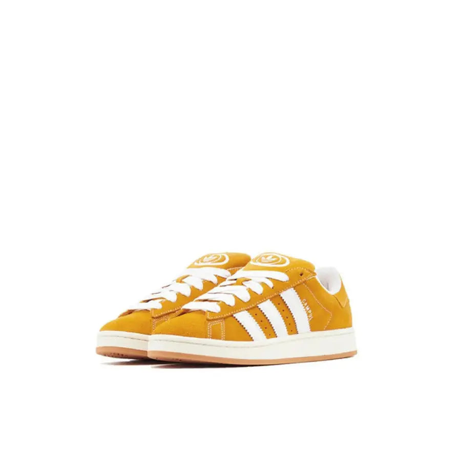 Yellow Adidas Women Sneakers with white stripes and laces
