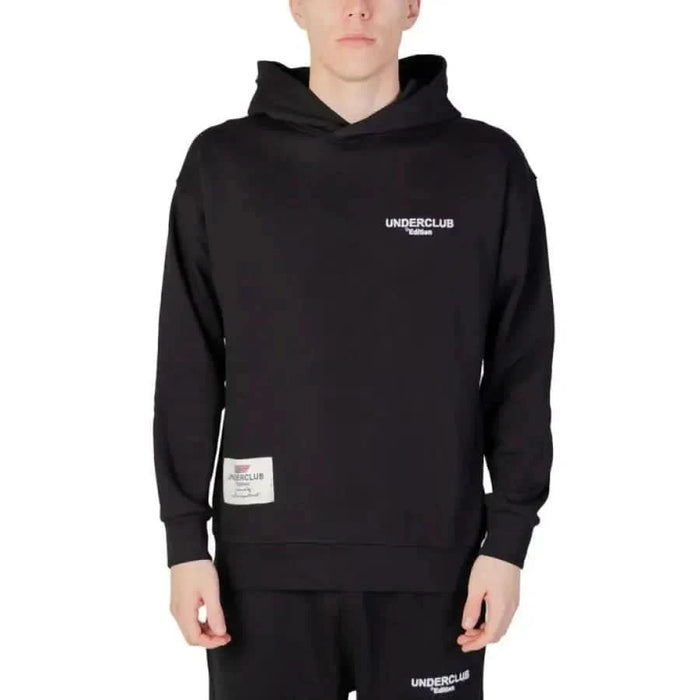 Young man in Underclub urban style black hoodie for city fashion