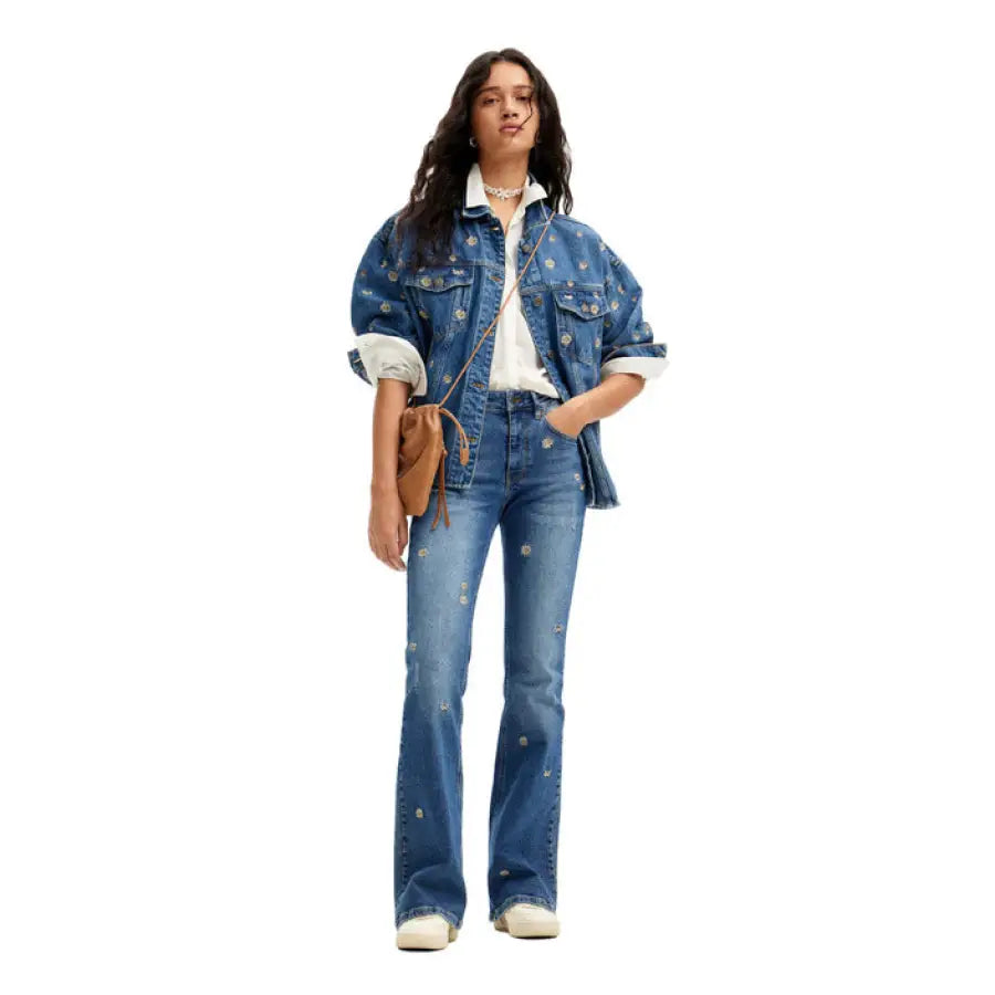 Young woman in flared jeans and oversized jacket from Desigual Women Jeans collection