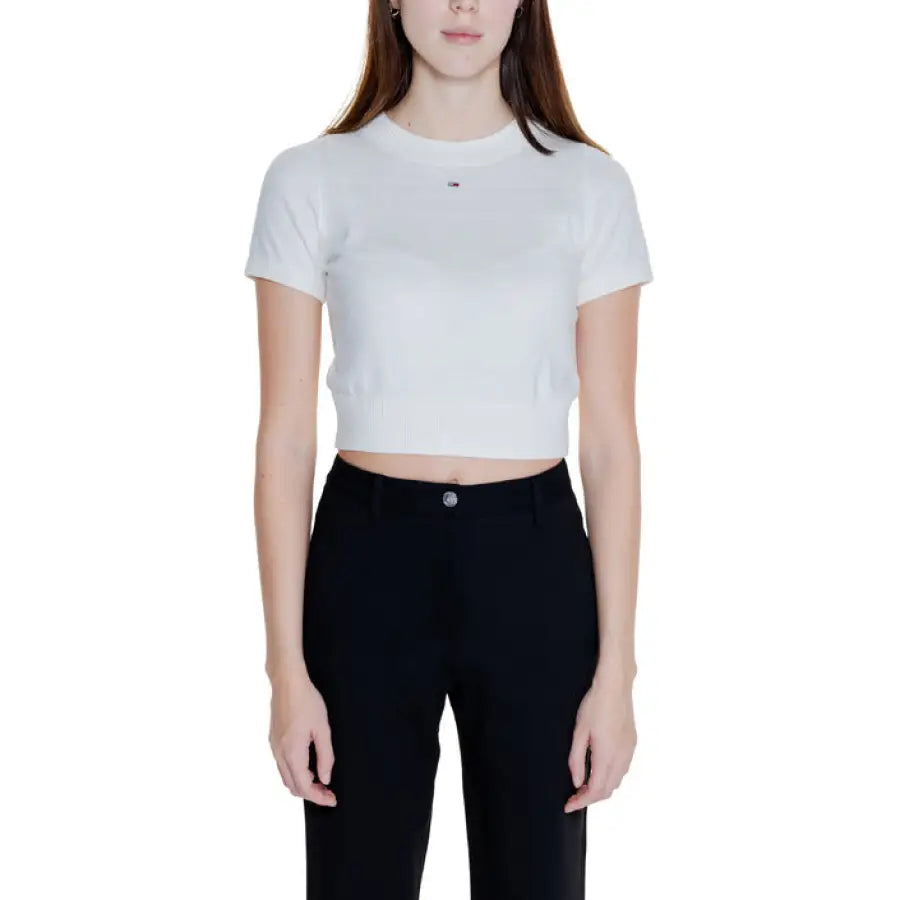 Young woman in white crop top and black pants - Tommy Hilfiger Jeans Women Knitwear